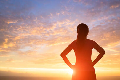 Silhouette Of Sport Woman Look Somewhere With Sunlight