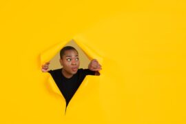 Woman Peeks Out Of A Box